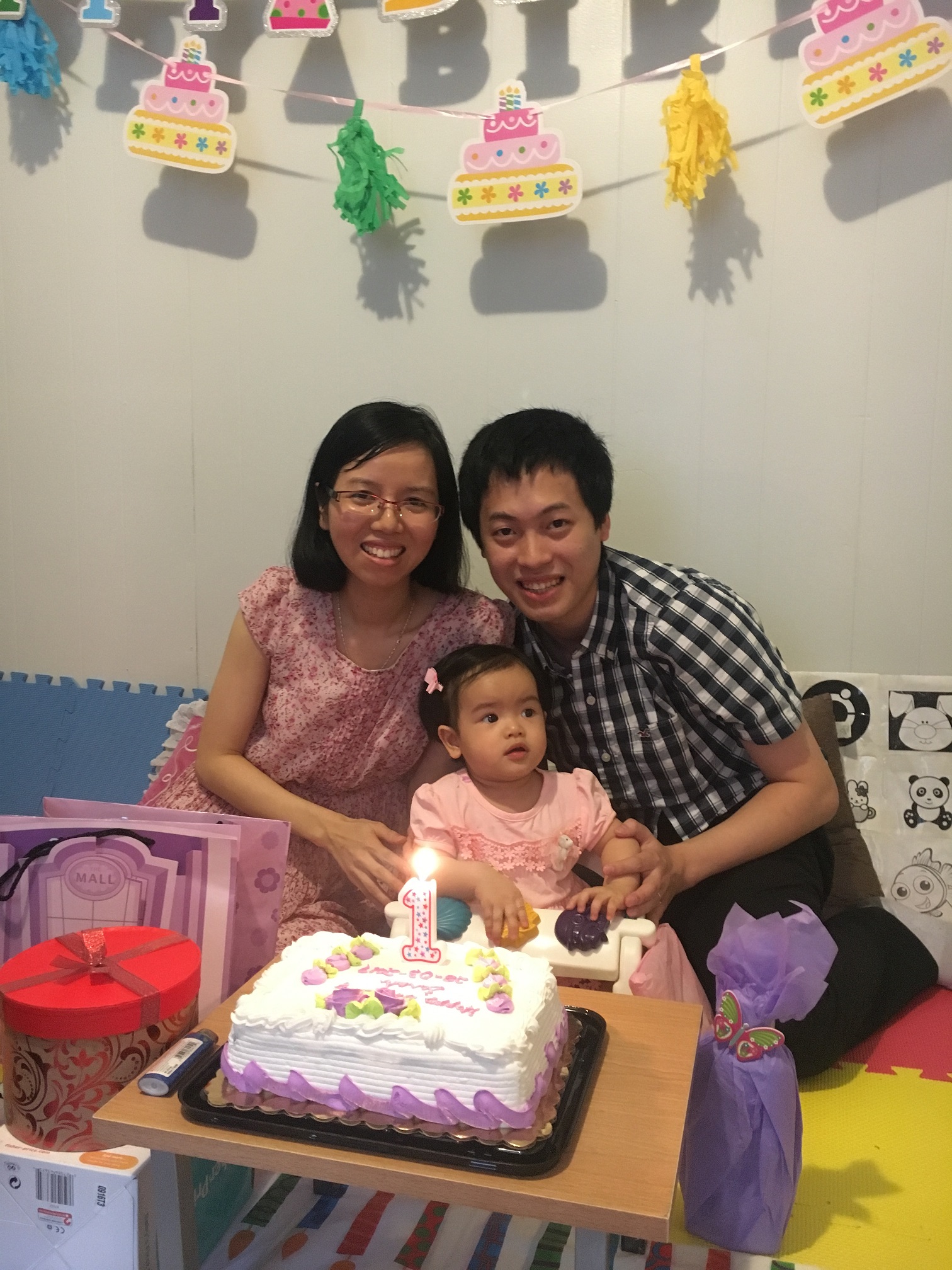 My wife Dung and our beloved daughter Sarah on her 1-year-old birthday (03/28/2017)